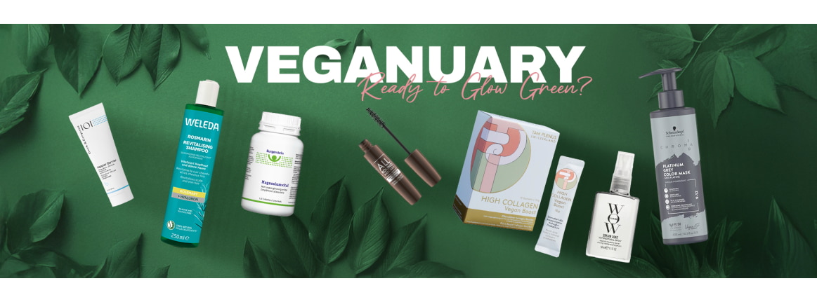 gruener hintergrund mit blaettern im vordergrund sind vegane produkte abgebildet