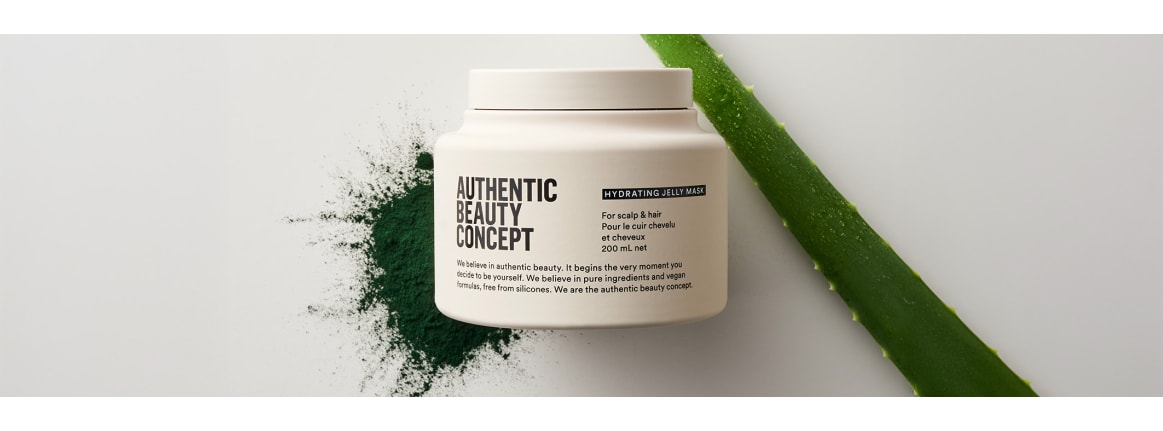 Masque capillaire d'Authentic Beauty Concept Arrière-plan avec une tache verte et un brin d'herbe